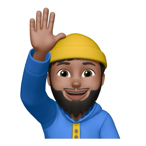 Kadir Islow smiling in a red plaid shirt and tortoise shell glasses